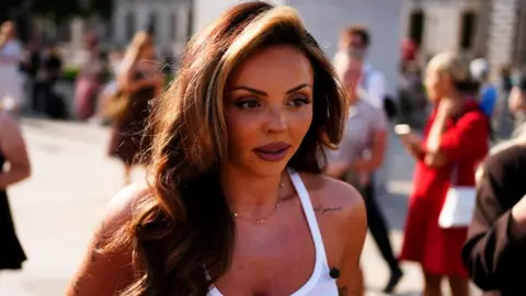 PA Media Former Little Mix singer Jesy Nelson in Parliament Square, London, ahead of the SMA screening debate at Westminster Hall in London. The former Little Mix singer has described the roll-out of spinal muscular atrophy (SMA) screening as a "postcode lottery" which "isn't fair". Picture date: Monday June 22, 2026
