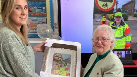 Pentyrch Primary School Lucy O'Leary with Hazel Davies and the cake