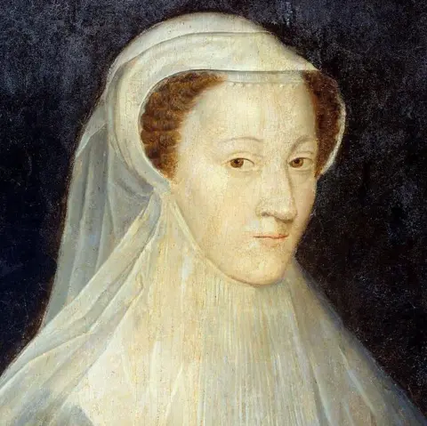 Getty Images The painted portrait of Mary shows her red hair under a white hood.