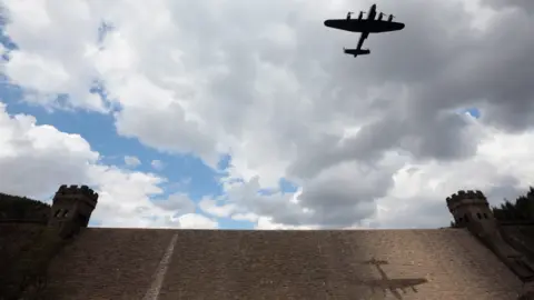 Getty Images A Lancaster passing over the Derwent dam as part of commemorations for the Dambusters raid