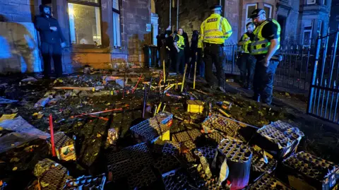 A house with firework launchers outsider and police in attendance