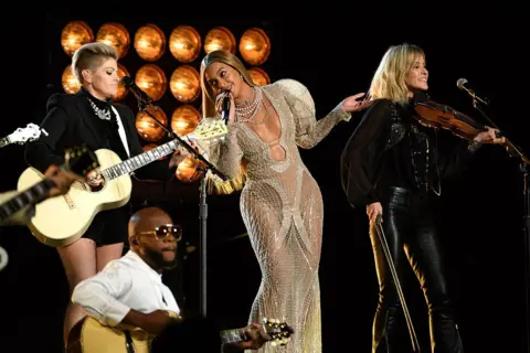 Getty Images Beyoncé performs onstage with The Chicks at the 2016 CMA Awards.