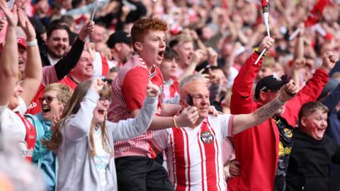 Southampton fans celebrate in the stand at Wembley