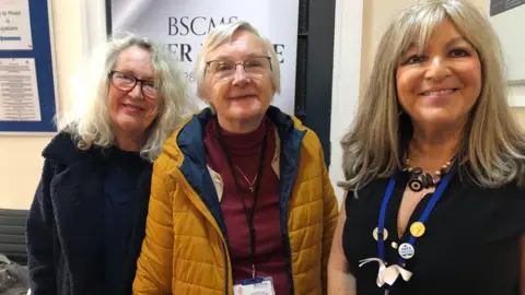 Jon Wright/BBC Carol Jones, Inga Lockington and Nadia Cenci stand together.