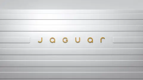 PA Media The new Jaguar logo in gold lettering, placed on a white background.