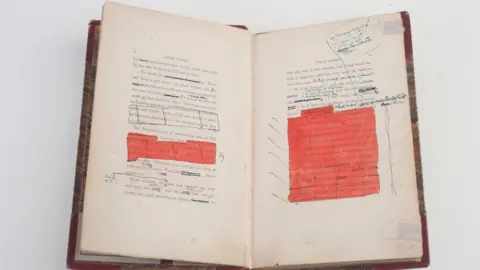 Charles Dickens Museum A copy of Dombey and Son open at two pages showing Charles Dickens' own handwriting in the margins.