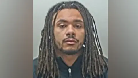 Lancashire Police Andrew Phillips is staring directly at the camera and he has no expression on his face in his police mugshot.