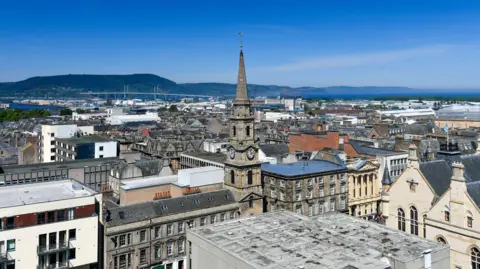 A view across Inverness city centre towards the Kessock Bridge and the Black Isle on a beautiful sunny day.