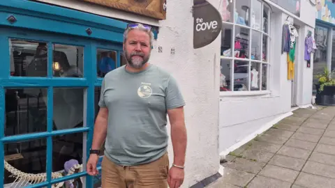 Duncan Kenny, co-owner of non-profit conservation shop, The Cove, in Brixham Harbour