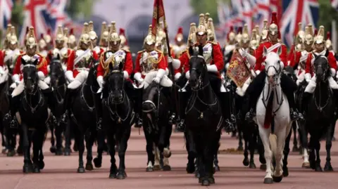 Reuters Members of the Household Cavalry ride on horseback as they take part in rehearsals for Trooping the Colour