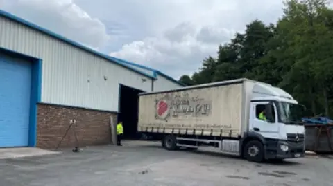 HSE Lorry reversing into the British Millerain Company Limited depot in Rochdale.