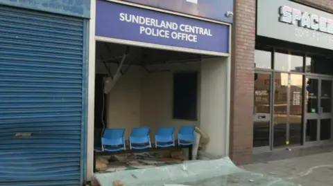 Sunderland Central Police Office with its window smashed in an insulation strewn on the ground