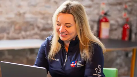 British Elite Athletes Association Elaine Hunniford at a laptop