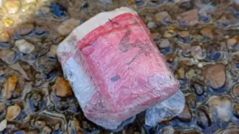 Nottinghamshire Police A package believed to be containing heroin found in a bathroom waste pipe