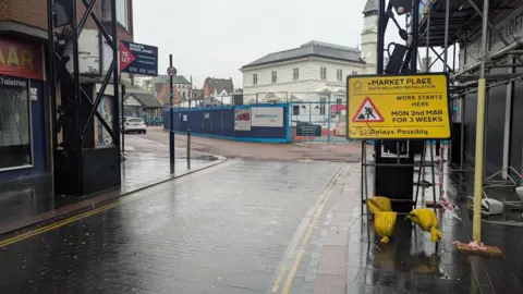 A sign informing that work is beginning on March 2 in front of Market Place