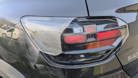 Zoe Farmer The rear light of Farmer's car is smashed with scruffs down the left side of the vehicle.