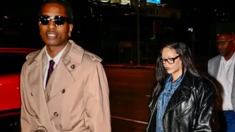 Getty Images A$AP Rocky and Rihanna walking outside in Los Angeles 