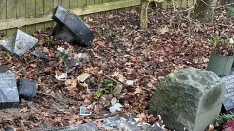 HFM A series of scattered and damaged memorial stones