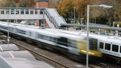 SWR Blurred train travelling through a train station