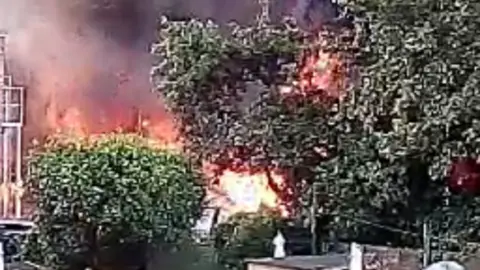 Resident handout An image of a fire which appears to be close to some trees