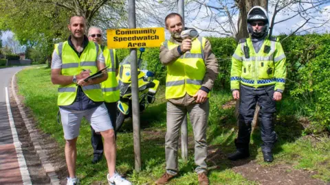 Staffordshire Police Police officers with a community speed watch group