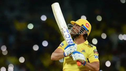 Chennai Super Kings' captain Mahendra Singh Dhoni watches the ball after playing a shot during the Indian Premier League (IPL) Twenty20 cricket match between Chennai Super Kings and Lucknow Super Giants at the MA Chidambaram Stadium in Chennai on April 3, 2023. 