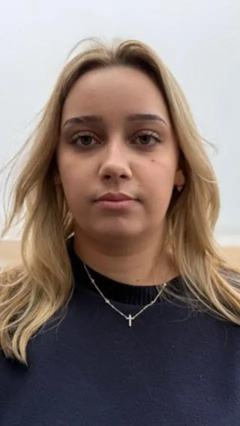 Young woman looks at the camera. 