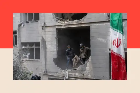 Getty Images People clear rubble in a house in the Beryanak District after it was damaged by missile attack in Tehran, Iran
