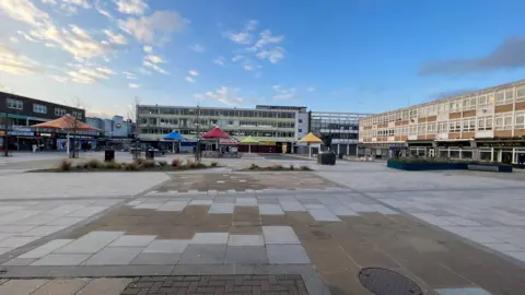 Simon Dedman/BBC The empty looking Market Square in Harlow