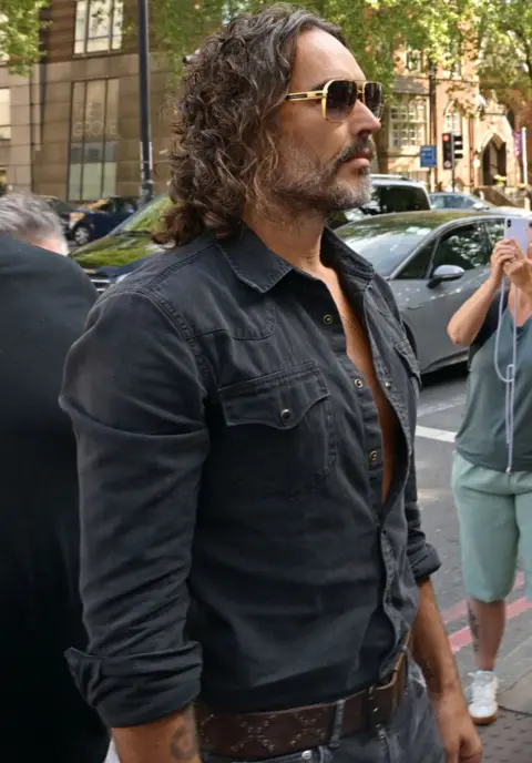 Getty Images Russell Brand arrives at Westminster Magistrates' Court on May 02, 2025 in London, England