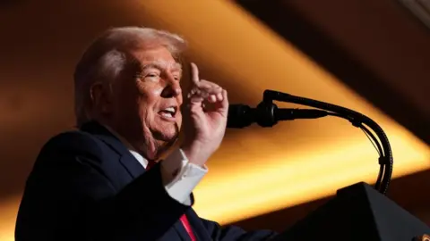 Image shows Trump speaking on Tuesday night