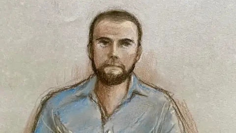 A court sketch of Jack Shepherd. He is seen wearing a blue shirt, has a beard and short hair, and is set against a plain background.