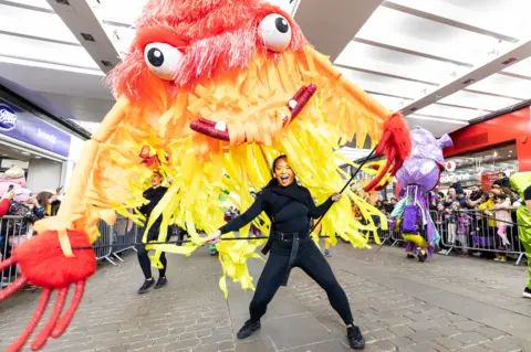 Fabio DePaola/Pennsylvania. Media Assignments A giant yellow and red monster with bulging eyes takes to the streets of Manchester. 