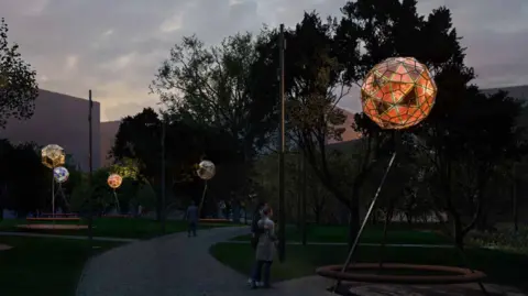 Oxford North Artist impression of five illuminated glass balls on top of metal tripods in the park at dusk. 