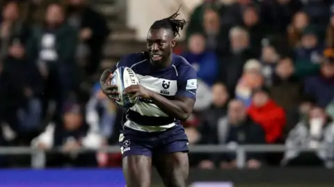 Gabriel Ibitoye running with the ball during Bristol's game against Sale