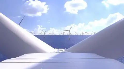The Dogger Bank Wind Farm. Dozens of wind turbines can be seen in the sea. The view is taken from the top of one of the turbines. 