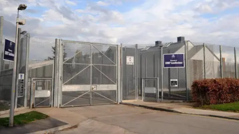 File photo dated 01/05/08 of a general view of Lindholme Prison near Doncaster. The picture shows a high fence surrounding a building. A blue sign reads "Welcome to HMP Lindholme".