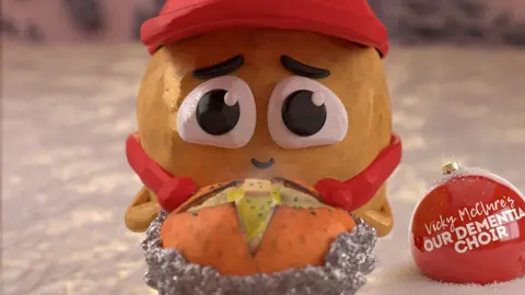 SpudBros/Chris Tootell Screengrab from the vide of an aminated spud with big eyes holding a baked potato.