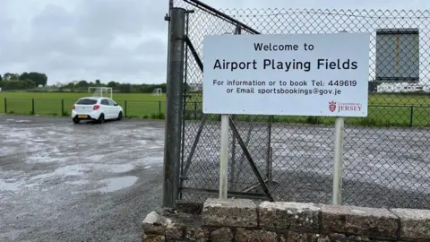BBC The Airport Playing Fields and sign with one car in the car park
