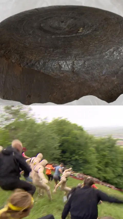 Half the image is a wooden cheese, the other half is people taking part in cheese rolling.