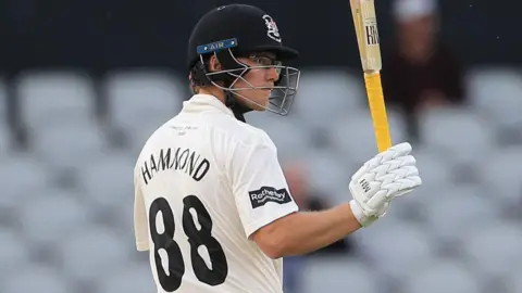 Miles Hammond celebrates scoring fifty