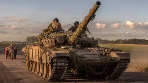 Getty Images Ukrainian servicemen operate a Soviet-made T-72 tank in the Sumy region on August 12, amid an ongoing offensive into nearby Russian territory.