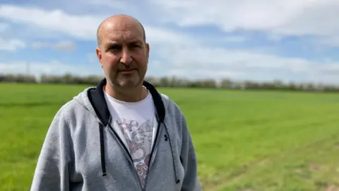 Andy Trigg/BBC Daryl Packer at the site of the proposed quarry