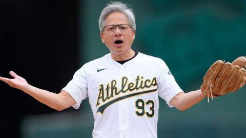 Jensen Huang, chief executive of Nvidia stands on the mound waiting to throw out the ceremonial first pitch prior to the start of the game between the Houston Astros and Oakland Athletics on May 25, 2024