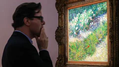 Getty Images A man gasps looking at a colourful painting