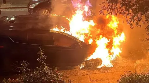 Supplied A car on fire on a Kentish Town street