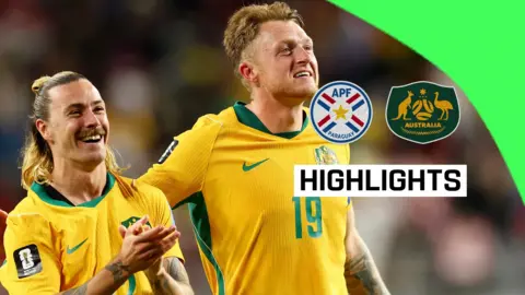 Jackson Irvine and Harry Souttar celebrate qualification