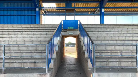 Image showing concrete steps where seating used to be of the former speedway track.