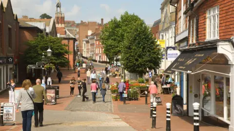 People walking down a pedestrianised high street