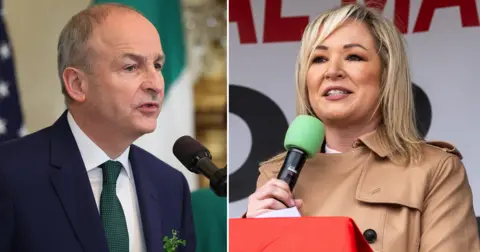 a composite image of Micheal Martin on the left - in a suit with some shamrocks pinned to the lapel, speaking into a microphone - and Michelle O'Neill on the left, wearing a trench coat and speaking into a microphone, with a banner visible behind her but the words obscured